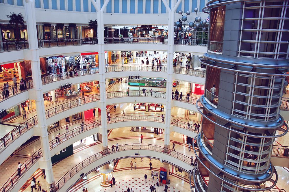 Wide shot of multi-story shopping mall interior